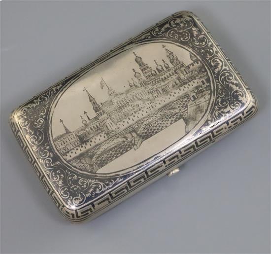 A late 19th century Russian 84 zolotnik silver and niello cigarette case, decorated with view of Red Square